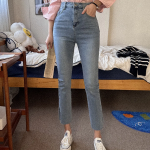 Женские джинсы с высокой посадкой, разрезами по низу и супероблегающим кроем