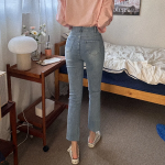 Женские джинсы с высокой посадкой, разрезами по низу и супероблегающим кроем