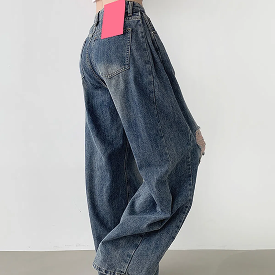 Женские баллон-джинсы с прорезями, защипами по бокам и объёмным широким кроем