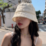 Marie Embossed Pom-Pom Bucket Hat — текстурная панама с помпоном и эффектной посадкой