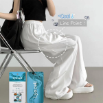 Свободные брюки из тенсела с эластичным поясом и разрезами