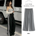 Широкие трикотажные брюки с кружевной отделкой и эластичным поясом