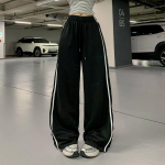 Широкие трикотажные брюки с кружевной отделкой и эластичным поясом