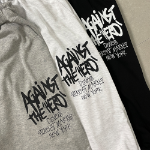 Удлинённые широкие тренировочные брюки в стритстайле с английским принтом