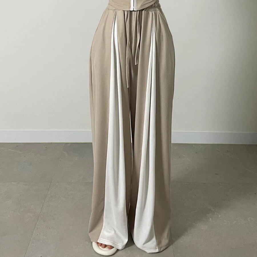 Широкие трикотажные брюки с контрастными вставками и защипами