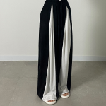 Широкие трикотажные брюки с контрастными вставками и защипами