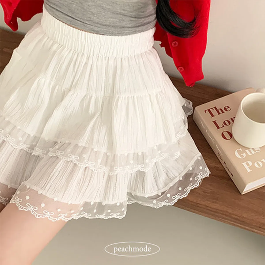 Мини-юбка с бантом, гороховым принтом и кружевными фестонами