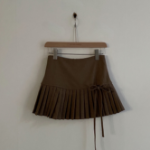 Мини-юбка с высокой посадкой, складками и бантом