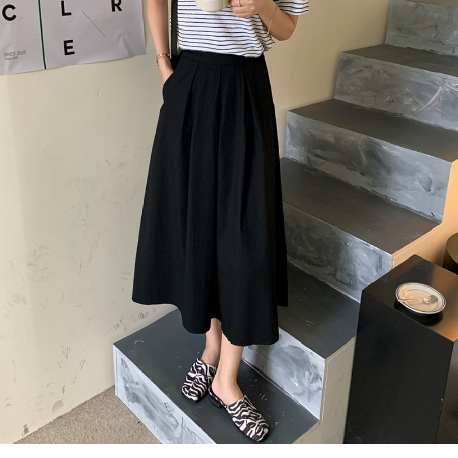 Расклешённая длинная юбка с пинтами