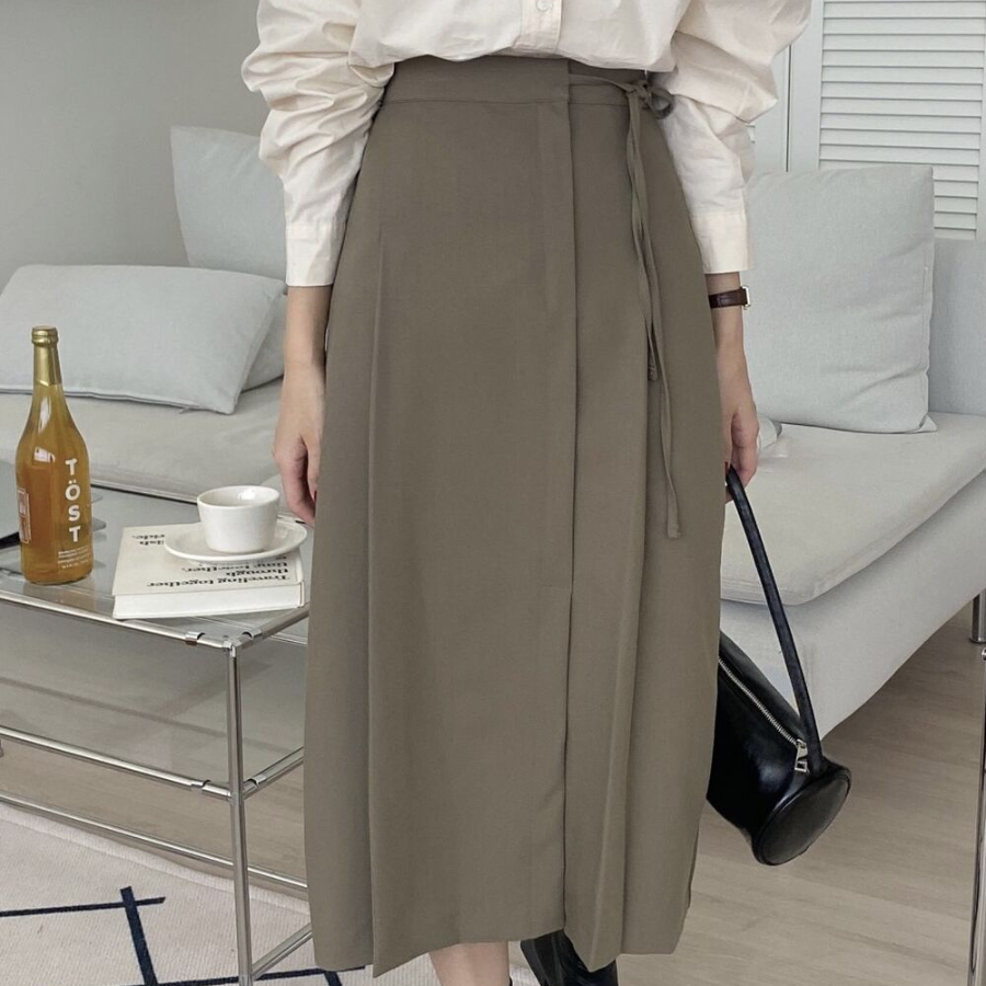 Длинная юбка с бантом "MYKKSK B" — модель-трансформер с запахом и A-силуэтом