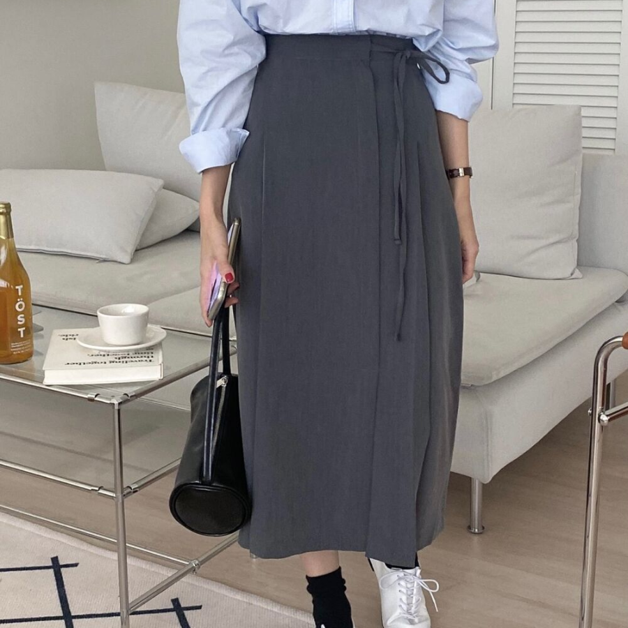 Длинная юбка с бантом "MYKKSK B" — модель-трансформер с запахом и A-силуэтом