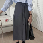 Длинная юбка с бантом "MYKKSK B" — модель-трансформер с запахом и A-силуэтом