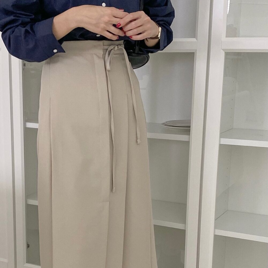 Длинная юбка с бантом "MYKKSK B" — модель-трансформер с запахом и A-силуэтом