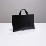 FREAKYNORMAL Enamel Document Bag — строгая форма, смелый глянец