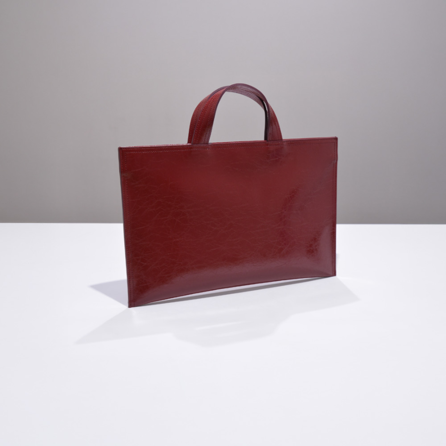 FREAKYNORMAL Enamel Document Bag — строгая форма, смелый глянец