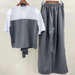 Асимметричный летний костюм из топа с коротким рукавом и широких штанов
