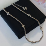 Серебристое колье на шариковой цепочке с цветочными крестиками из хирургической стали