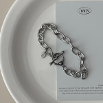 Браслет из хирургической стали с цепочкой и застёжкой в виде косточки (тогл-бар)