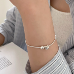 Серебряный браслет с подвеской в форме сердца и бусиной на гладкой цепочке