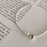 Серебряный браслет с подвеской в форме сердца и бусиной на гладкой цепочке