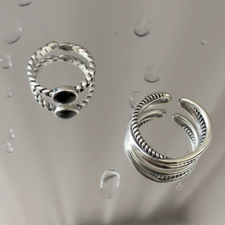 Серебряное кольцо с двойным плетёным узором и чёрной вставкой