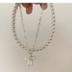 Серебряный браслет с подвеской в виде банта и двойной цепочкой