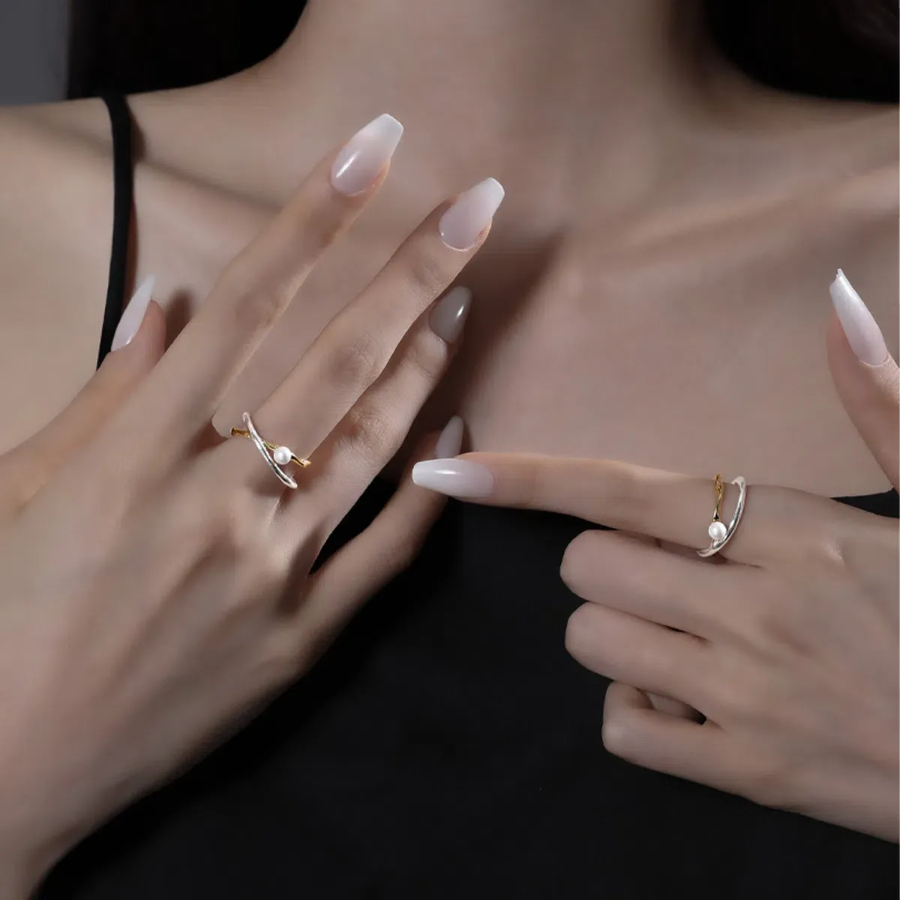 Серебряное открытое кольцо с маленькой жемчужиной и перекрёстным узлом